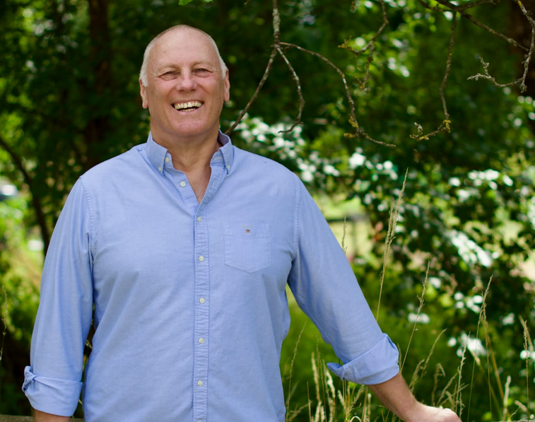 Tony Baxter integrative counsellor smiling outdoors in Hertfordshire